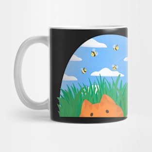 Ginger cat playing in the grass Mug